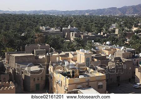 View of the oasis city of Nizwa, with its palm gardens, Oman, Arabian Peninsula, Middle East, Asia View Large Photo Image Stock Image - View of the oasis city of Nizwa, with its palm gardens, Oman, Arabian Peninsula, Middle East, Asia. Fotosearch