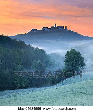 View of Wartburg Castle at sunrise, morning fog, meadow with dew, Eisenach, Thuringia, Germany, Europe View Large Photo Image Stock Photograph - View of Wartburg Castle at sunrise, morning fog, meadow with dew, Eisenach, Thuringia, Germany, Europe. Fotosearch