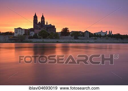 View over river Elbe to Magdeburg Cathedral, city view at sunset, Magdeburg, Saxony-Anhalt, Germany, Europe View Large Photo Image Stock Photo - View over river Elbe to Magdeburg Cathedral, city view at sunset, Magdeburg, Saxony-Anhalt, Germany, Europe. Fotosearch