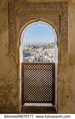 Stock Image - View through an archway decorated with arabesques, Moorish ornaments, Summer Palace Generalife, Palacio de Generalife, Granada, Andalusia, Spain, Europe. Fotosearch