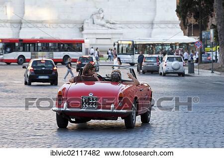 Stock Image - Vintage car on the Piazza Venezia, Rome, Italy, Europe. Fotosearch