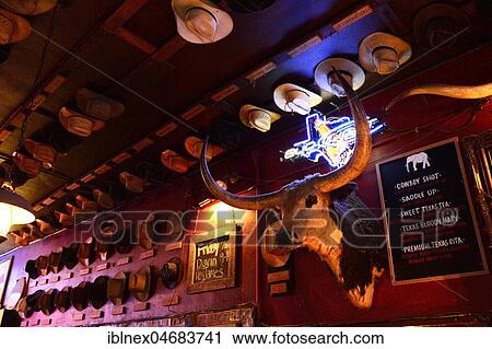 Wall with stuffed longhorn and many cowboy hats in a bar, White Elephant Saloon, Stockyards National Historic District, Fort Worth, Texas, USA, North America View Large Photo Image Stock Image - Wall with stuffed longhorn and many cowboy hats in a bar, White Elephant Saloon, Stockyards National Historic District, Fort Worth, Texas, USA, North America. Fotosearch