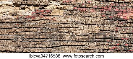 Stock Photo - Weathered wood with red colour residues, detail, background image. Fotosearch