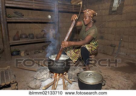 Woman cooking in a kitchen, Bamenda, Cameroon, Africa View Large Photo Image Stock Image - Woman cooking in a kitchen, Bamenda, Cameroon, Africa. Fotosearch