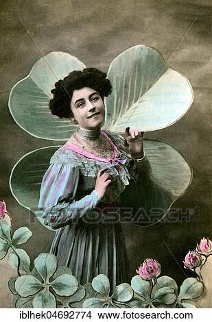 Woman in front of a four-leaf clover, 1910s, Germany, Europe View Large Photo Image Picture - Woman in front of a four-leaf clover, 1910s, Germany, Europe. Fotosearch