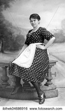 Stock Photograph - Woman posing with apron, maid, 1920s, Germany, Europe. Fotosearch