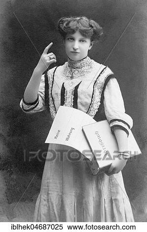 Woman with raised index finger, 1910s, Germany, Europe View Large Photo Image Stock Photography - Woman with raised index finger, 1910s, Germany, Europe. Fotosearch