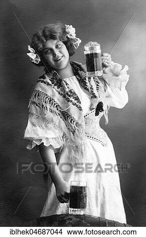 Woman with two beer mugs, 1910s, Germany, Europe View Large Photo Image Picture - Woman with two beer mugs, 1910s, Germany, Europe. Fotosearch
