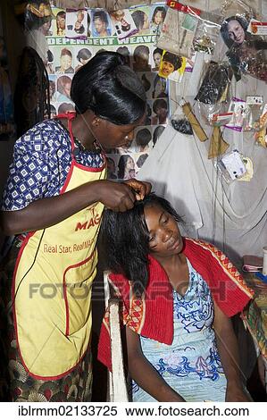 Stock Photography - Women in a hair salon, Bamenda, Cameroon, Africa. Fotosearch