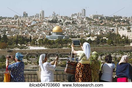 Women photograph the Dome of the Rock, qubbat as-sachra, Kipat Hasela, on the Temple Mount, Old Town, and the Skyline, Jerusalem Israel View Large Photo Image Stock Image - Women photograph the Dome of the Rock, qubbat as-sachra, Kipat Hasela, on the Temple Mount, Old Town, and the Skyline, Jerusalem Israel. Fotosearch