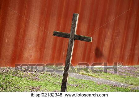 Wooden cross in front of a wall View Large Photo Image Stock Photo - Wooden cross in front of a wall. Fotosearch