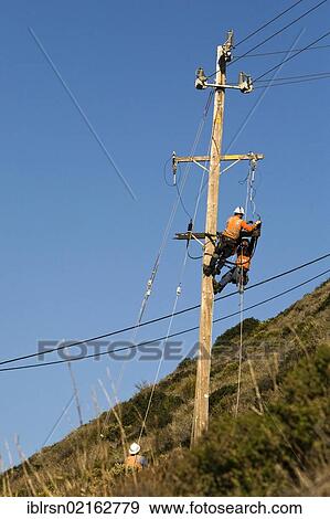 Workers of the PG&E power company working on a pylon, Big Sur, California, USA, North America View Large Photo Image Stock Photo - Workers of the PG&E power company working on a pylon, Big Sur, California, USA, North America. Fotosearch
