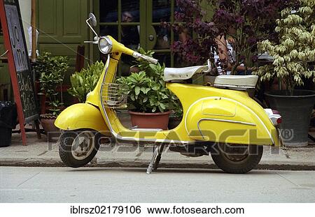 Stock Photograph - Yellow Vespa, Luang Prabang, Laos, Southeast Asia, Asia. Fotosearch
