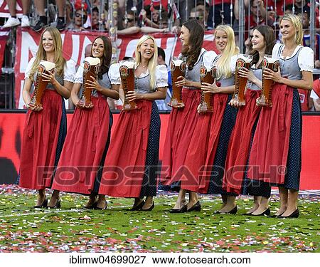 Young ladies with wheat beer for beer shower, Allianz Arena, Munich, Bavaria, Germany, Europe View Large Photo Image Stock Photo - Young ladies with wheat beer for beer shower, Allianz Arena, Munich, Bavaria, Germany, Europe. Fotosearch