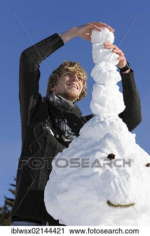 Young man building a snowman, Black Forest, Baden-Wuerttemberg, Germany, Europe, PublicGround, Europe View Large Photo Image Stock Image - Young man building a snowman, Black Forest, Baden-Wuerttemberg, Germany, Europe, PublicGround, Europe. Fotosearch