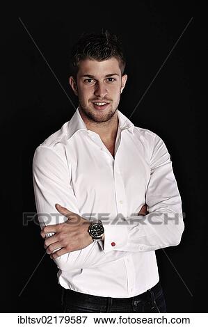 Young man wearing a shirt, with arms crossed View Large Photo Image Stock Photo - Young man wearing a shirt, with arms crossed. Fotosearch