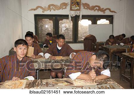 Young men training to become wood carvers, crafts, handicrafts, National Institute of Zorig Chusum, Painting School, capital of Thimphu, the Himalayas, Kingdom of Bhutan, South Asia, Asia View Large Photo Image Stock Image - Young men training to become wood carvers, crafts, handicrafts, National Institute of Zorig Chusum, Painting School, capital of Thimphu, the Himalayas, Kingdom of Bhutan, South Asia, Asia. Fotosearch