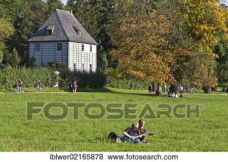 Stock Photo - Young people playing guitar in front of Goethe's Garden House, Park an der Ilm, Weimar, Thuringia, Germany, Europe. Fotosearch