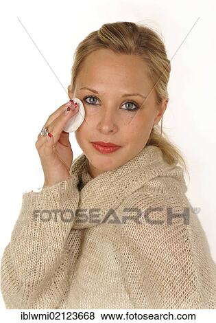 Young woman applying make-up, powder View Large Photo Image Stock Photo - Young woman applying make-up, powder. Fotosearch