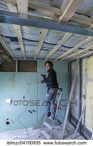 Young woman renovating the attic in an old house, Mecklenburg-Western Pomerania, Germany, Europe View Large Photo Image Stock Photography - Young woman renovating the attic in an old house, Mecklenburg-Western Pomerania, Germany, Europe. Fotosearch