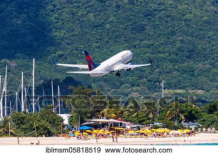A Boeing 737-700 of Delta Air Lines with the registration number N304DQ at St. Maarten Airport (SXM), Sint Maarten, North America View Large Photo Image Stock Photo - A Boeing 737-700 of Delta Air Lines with the registration number N304DQ at St. Maarten Airport (SXM), Sint Maarten, North America. Fotosearch