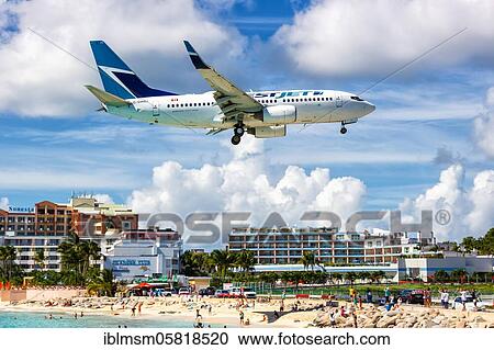 A Boeing 737-700 of the Westjet with the registration number C-GWBJ at the airport St. Maarten (SXM), Sint Maarten, North America View Large Photo Image Stock Image - A Boeing 737-700 of the Westjet with the registration number C-GWBJ at the airport St. Maarten (SXM), Sint Maarten, North America. Fotosearch