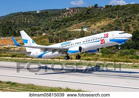 Stock Photo - A Boeing 737-800 of Enter Air with the registration SP-ENX and the special painting 100 years of independence at Skiathos Airport (JSI), Skiathos, Greece, Europe. Fotosearch