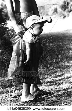 A little boy is carried in a plastic bag, between 50s and 60s, exact place unknown, France, Europe View Large Photo Image Stock Photo - A little boy is carried in a plastic bag, between 50s and 60s, exact place unknown, France, Europe. Fotosearch