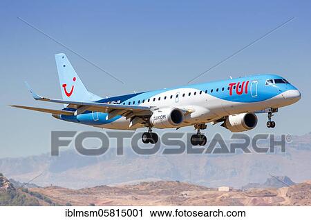 Stock Image - A TUI Embraer ERJ190 with the registration OO-JVA lands at Malaga Airport (AGP), Malaga, Spain, Europe. Fotosearch