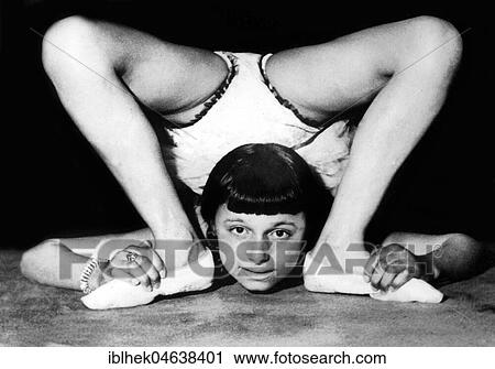Acrobat looks from behind through her legs, ca. 1930, 1930s, exact place unknown, Germany, Europe View Large Photo Image Stock Image - Acrobat looks from behind through her legs, ca. 1930, 1930s, exact place unknown, Germany, Europe. Fotosearch