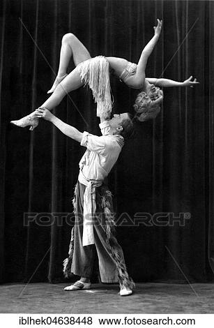 Acrobats, man carries woman, ca. 1926, 1920s, exact place unknown, Germany, Europe View Large Photo Image Stock Photo - Acrobats, man carries woman, ca. 1926, 1920s, exact place unknown, Germany, Europe. Fotosearch