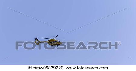Stock Image - ADAC helicopter in flight, rescue helicopter, Bavaria, Germany, Europe. Fotosearch