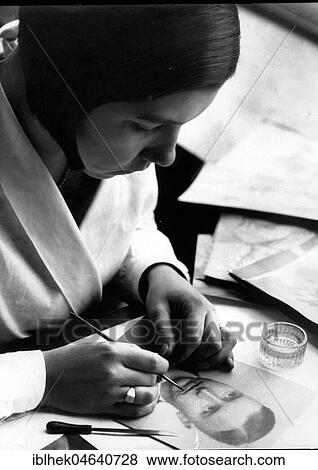 Stock Photo - Advertising, graphic artist at work, photo retouching, 1940s, exact location unknown, Germany, Europe. Fotosearch