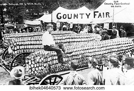 Stock Image - Agriculture, huge corn cob on the market, 1900s, exact place unknown, USA, North America. Fotosearch