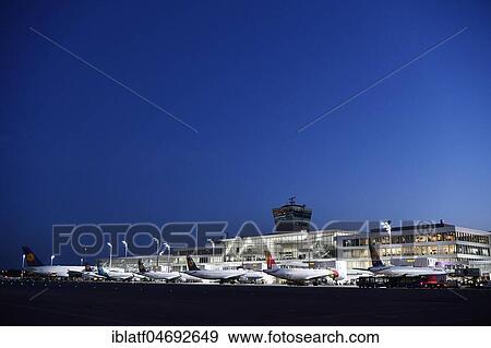 Airlines, line up, terminal 2, at night, Munich airport, Upper Bavaria, Bavaria, Germany, Europe View Large Photo Image Stock Photo - Airlines, line up, terminal 2, at night, Munich airport, Upper Bavaria, Bavaria, Germany, Europe. Fotosearch