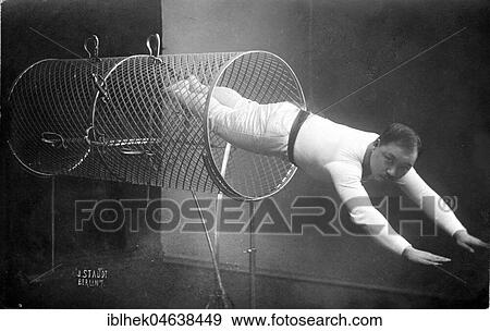 Akrobat jumps through a metal tube, ca. 1929, 1920s, exact place unknown, Germany, Europe View Large Photo Image Stock Photo - Akrobat jumps through a metal tube, ca. 1929, 1920s, exact place unknown, Germany, Europe. Fotosearch