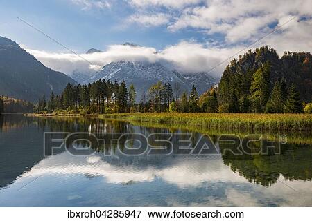 Stock Photo - Almsee im Herbst mit Wolken, Totes Gebirge, Almtal, Oberosterreich, Osterreich, Europa. Fotosearch