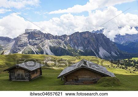 Alpine huts with view of the Sellastock, mountain massif, South Tyrolean Alps, Dolomites, South Tyrol View Large Photo Image Stock Image - Alpine huts with view of the Sellastock, mountain massif, South Tyrolean Alps, Dolomites, South Tyrol. Fotosearch