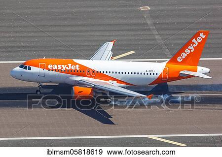 An Easyjet Airbus A319 with the registration number G-EZDJ at Gibraltar Airport (GIB), Gibraltar, Europe View Large Photo Image Stock Photo - An Easyjet Airbus A319 with the registration number G-EZDJ at Gibraltar Airport (GIB), Gibraltar, Europe. Fotosearch