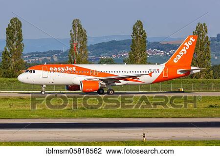 Stock Image - An EasyJet Switzerland Airbus A320 with the registration number HB-JXC at EuroAirport Basel Mulhouse (EAP), Mulhouse, France, Europe. Fotosearch