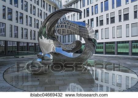 Stock Image - Angerhofbrunnen, Modern stainless steel sculpture Air born by Christopher Klein, Linde headquarters, Munich, Upper Bavaria, Bavaria, Germany, Europe. Fotosearch