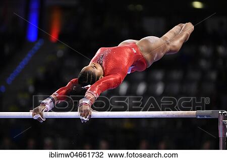 Stock Image - Apparatus Gymnastics, Jordan Chile, USA, at uneven bars, Porsche Arena, Stuttgart, Baden-Württemberg, Germany, Europe. Fotosearch
