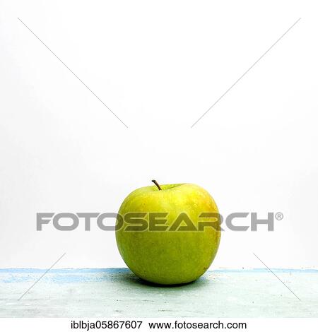Stock Photo - Apple on a white background, studio shot, France, Europe. Fotosearch