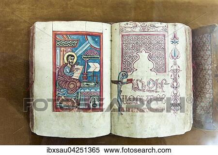 Stock Photography - Armenisch-apostolische Kirche, alte Bibel, gemalter Evangelist, armenische Schrift, aufgeschlagenes Buch im Museum, Vank-Kathedrale, Jolfa oder Neu-Dschulfa, Isfahan, Iran. Fotosearch
