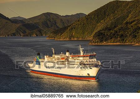 Stock Photography - Arriving ferry from the North Island at sunset, Picton, Marlborough Sounds, South Island, New Zealand, Oceania. Fotosearch