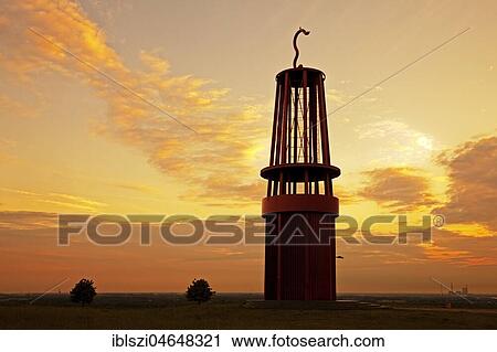Stock Image - Artwork Geleucht at sunset, artist Otto Piene, stockpile Rheinpreussen, Moers, Ruhr Area, North Rhine-Westphalia, Germany, Europe. Fotosearch