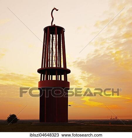 Stock Image - Artwork Geleucht at sunset, artist Otto Piene, stockpile Rheinpreussen, Moers, Ruhr Area, North Rhine-Westphalia, Germany, Europe. Fotosearch
