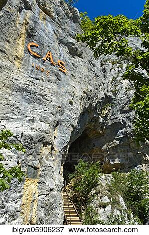 Stock Photo - At the entrance to the Orjobet cave on the Orjobet geological trail to the summit of Mont Salève, Collonges-sous-Salève, Haute-Savoie, France, Europe. Fotosearch