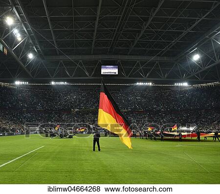 Atmospheric flag wavers with German flag in front of the start of the football match, Esprit Arena, Düsseldorf, North Rhine-Westphalia, Germany, Europe View Large Photo Image Stock Photo - Atmospheric flag wavers with German flag in front of the start of the football match, Esprit Arena, Düsseldorf, North Rhine-Westphalia, Germany, Europe. Fotosearch