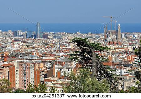 Ausblick vom Park Guell auf die Stadt mit Sagrada Familia und Torre Agbar, hinten Mittelmeer, Barcelona, Katalonien, Spanien, Europa View Large Photo Image Stock Photo - Ausblick vom Park Guell auf die Stadt mit Sagrada Familia und Torre Agbar, hinten Mittelmeer, Barcelona, Katalonien, Spanien, Europa. Fotosearch